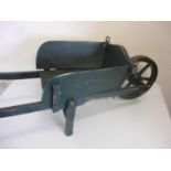Miniature wooden constructed model of a long handled wheelbarrow with painted detail (overall length