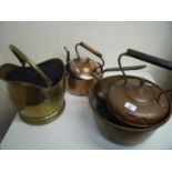 Copper coal helmet, a brass jam pan, copper kettle with acorn finial, another similar smaller kettle