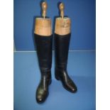 Pair of black leather riding boots with wooden trees by Peal & Co London patent 5562