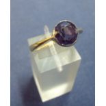 18ct gold ring set with large circular multi-faceted blue stone