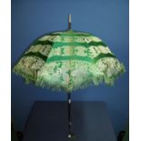 19th C ladies parasol with green silk work canopy and carved ivory finials (length 73cm)