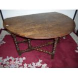 18th/19th C oak dropleaf gate-leg table on bobbin turn supports with single drawer to the end (