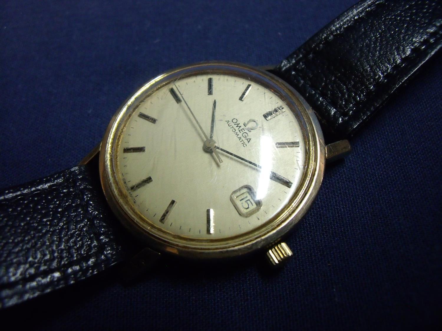 Gents 9ct gold cased Omega automatic wristwatch with black leather strap and state dial, the back