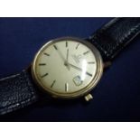 Gents 9ct gold cased Omega automatic wristwatch with black leather strap and state dial, the back