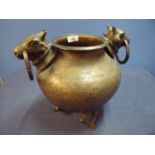 Large Eastern style bronze pot/sensor with twin cows head and bull ring handles with engraved floral