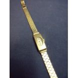 Ladies Vulova wristwatch with rectangular 9ct gold cased movements and articulated 9ct gold strap