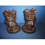 Pair of early to mid 19th C carved French wooden candlesticks depicting gentlemen heraldic