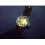 Tiny ladies Omega wristwatch in stainless steel case complete with leather strap, the winder