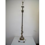 Elaborate gilt metal and marble effect standard lamp on claw feet (height 140cm)