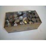 Tin containing a quantity of various mixed world coinage