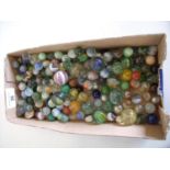 Box containing a large selection of various assorted old marbles of various sizes