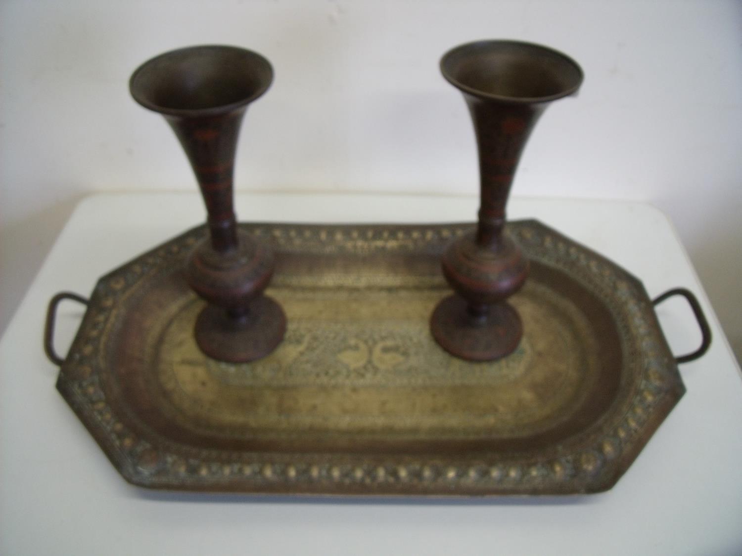 Rectangular twin handled Indian style brass tray with embossed detail and a pair of flared top vases