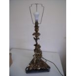 Elaborate early to mid 20th C table lamp with triangular marble base and gilt metal figure of a