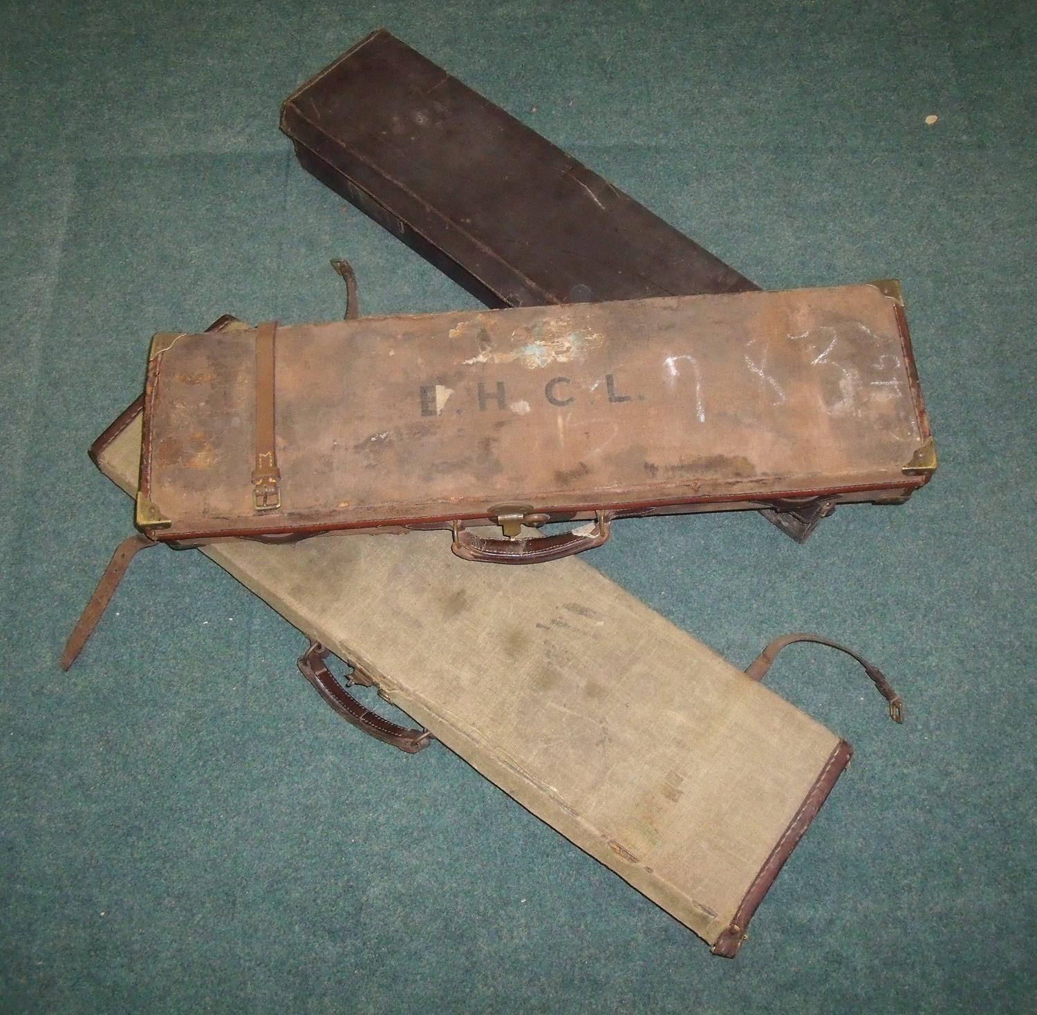 Three canvas and leather trimmed gun cases a/f