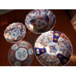 Large Imari pattern charger, two shallow dishes and similar bowl (4)