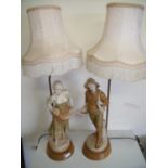 Pair of Royal Dux table lamps in the form of a couple sowing seeds and harvesting, mounted on wooden