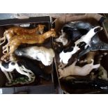 Two boxes containing a quantity of various decorative ceramics and other figures of dogs including