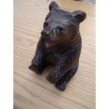 Carved wood Black Forest style figure of a seated bear (22cm high)