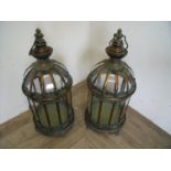 Pair of bronze metal and glazed floor lanterns with hanging loops (height approx. 60cm)