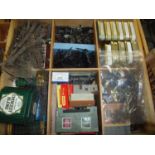 Multi-sectional drawer containing a large quantity of OO gauge railway accessories including control