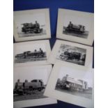 Box containing a selection of various black & white photographs of tanks and locomotives, mounted on