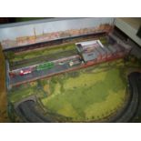 N gauge model railway layout with track scenery, buildings and accessories