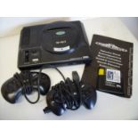 Sega Mega Drive games console including instructions, two controllers and a copy of PGA Tour Golf