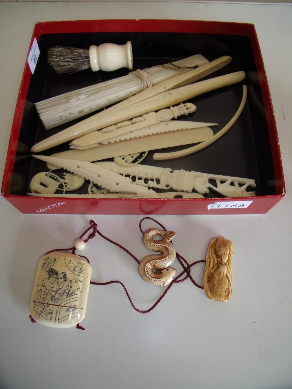 Pair of late Victorian large ivory glove stretchers, folding fan, various paper knives, shaving