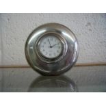 Unusual desk clock in silver plated case, with quartz movement (height 8cm)