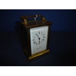 20th C brass cased carriage clock white enamel dial, lever platform escapement, retailed by