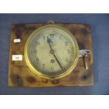 Brass cased bulk head wall clock with steel dial (diameter 17cm)