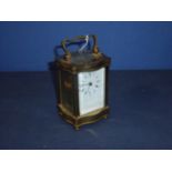 French 20th C brass cased carriage clock with white enamel dial, lever platform escapement