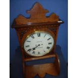 Wheeler of Worksop carved oak cased double fusee wall mounted bracket clock in light oak case,