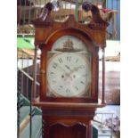 Stained pine cased 8 day long case clock with arched panted dial, with date and minute secondary