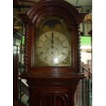 Elaborate oak cased 8 day long cased clock with carved and panelled detail to the case with arched