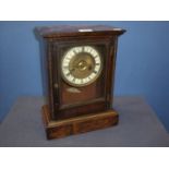 Late 19th C continental oak cased striking mantel clock with rope twist columns