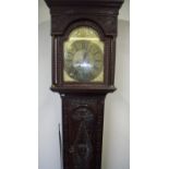 Heavy carved oak cased 8 day brass faced long case clock