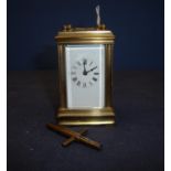 Early 20th C miniature brass carriage clock, white enamel dial, platform escapement and movement