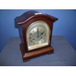 Early 20th C Junghans mahogany cased striking mantel clock, silver dial and chapter ring bearing