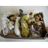Large selection of ceramic and other decorative figures, mostly wildlife animals, Native Indians etc