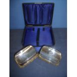 Cased pair of Birmingham 1909 silver backed clothes brushes with engraved monogrammed initials B A