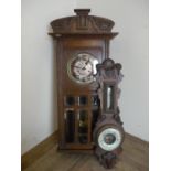 Oak cased steel faced wall clock with bevelled edge glass panels and an oak cased barometer A/F (2)