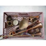 Box containing various copper and brass items including lamp, scales, ladle and hunting horns