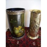 An embossed brass stick stand and a papier-mâché stick stand with painted decoration