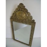 Embossed brass framed bevelled edge wall mirror (28cm x 50cm)