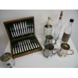 Oak cased set of twelve Mother of Pearl handled dessert knives and forks (A/F), silver plated and