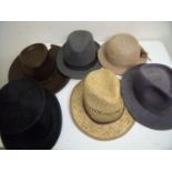 Collection of various vintage and modern hats, gaiters, side caps, bowler hats, top hats and an as-