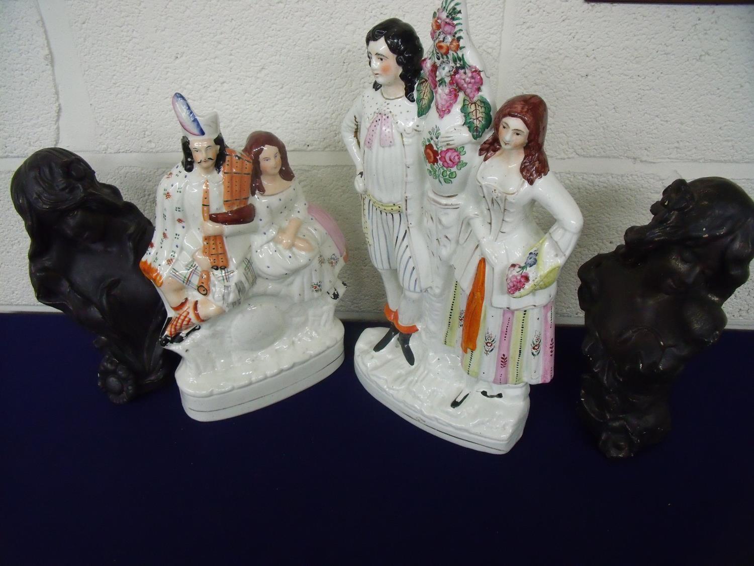 Two large Staffordshire flat back figures of courting couples and two bronze effect Art Nouveau