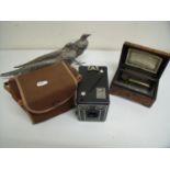 Burr walnut cased musical box (A/F), pair of silver plated pheasants and a cased Brownie D camera