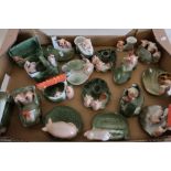 Box containing a large selection of unusual ceramic pig figures